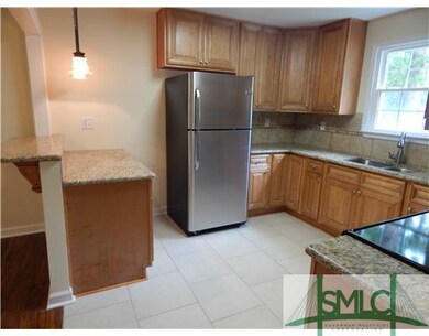 Kitchen. Breakfast bar with pendant lighting openi
