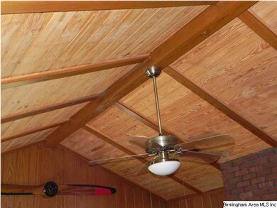 TONGUE-IN-GROVE VAULTED CEILING IN DEN. WOOD BEAMS