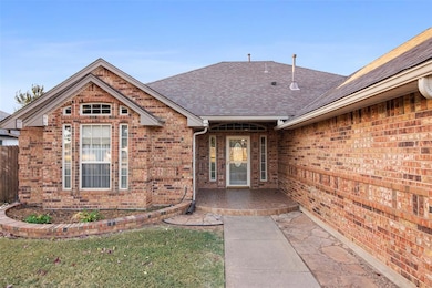 Property entrance with a patio area