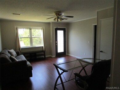 Living room looking out front windows and door