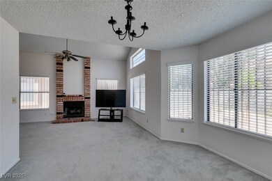 Unfurnished living room featuring carpet, a textur