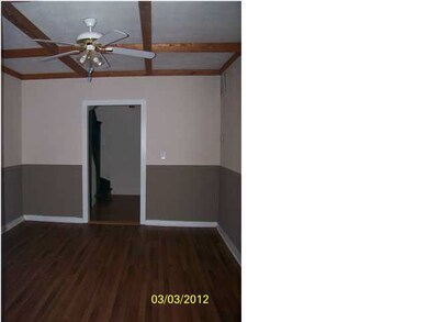 The Formal Dining Room has beautiful wood beams an