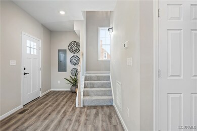 Entrance foyer with stairway, wood finished floors