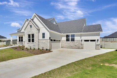 View of front of home featuring a garage and a fro
