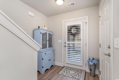 Doorway to outside with hardwood / wood-style floo