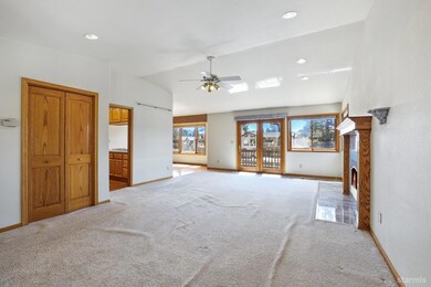 Living room with upstairs deck overlooking the boat dock.