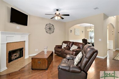 THE GREAT ROOM FEATURES A GAS FIREPLACE, WOOD FLOO