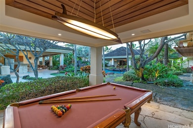 A billiards and game room opens up to the grounds