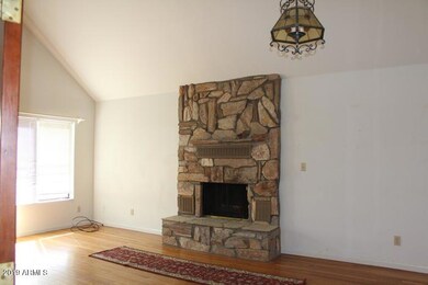 Living room with a stone fire place