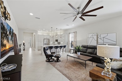 Living room featuring recessed lighting and light tile patterned floors