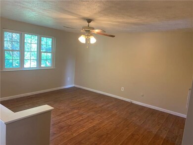 The bright and neutral freshly painted living room