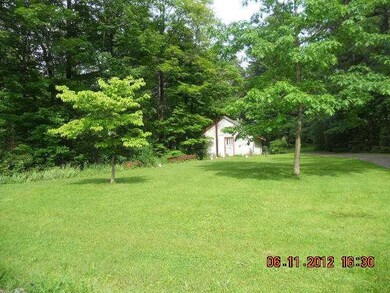 Exterior Front. View of detached one car garage. -