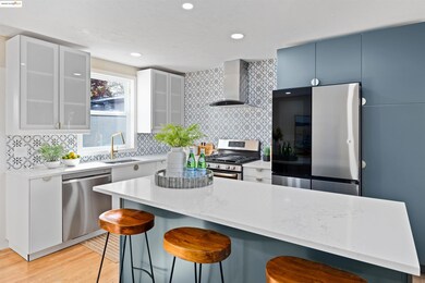 Kitchen featuring appliances with stainless steel finishes, backsplash, a breakfast bar, light stone counters, and recessed lighting