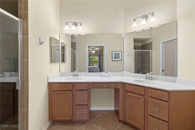 Full bath featuring ensuite bath, a shower stall,