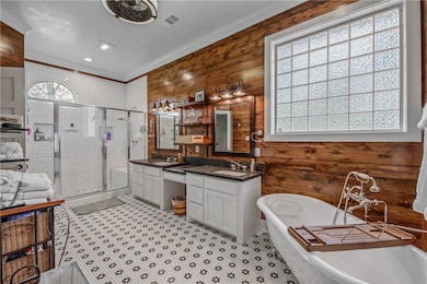 Full bathroom featuring visible vents, a stall sho