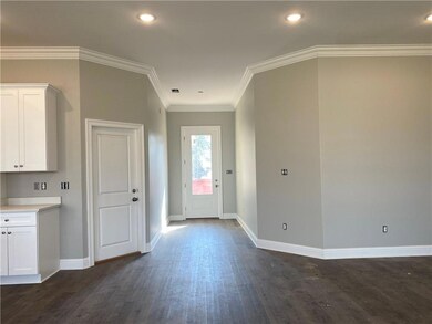 Welcoming foyer opens to living area.