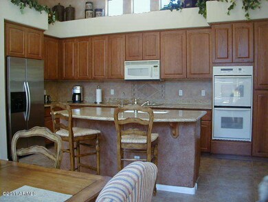EAT-IN KITCHEN WITH VIEWS OF COURTYARD