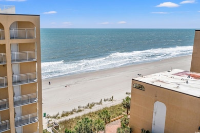 Property view of water with a beach view