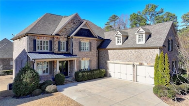 View of front of home featuring covered porch, a s
