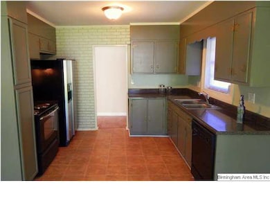 Remodeled kitchen with stainless fridge, double si