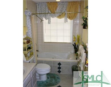 Exterior Front. HALL BATH WITH JETTED TUB AND TILE