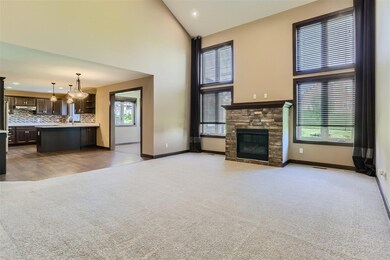 Living room has two-story vaults and a gas fireplace!