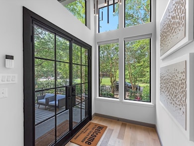Bright entryway with large windows offering abunda