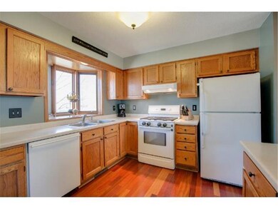 The kitchen is bright and inviting, with a bay win