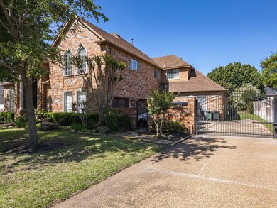 View of front of house featuring the gated drivewa
