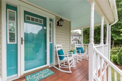 Notice the sky blue ceiling on the porch and fresh stained deck.