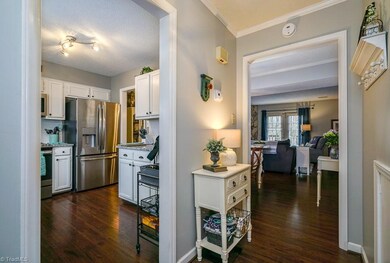 From front entry. Stairs are to the right. Kitchen to the left and living and dining rooms straight ahead