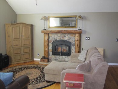 Living Room w wood burning fireplace insert & heat
