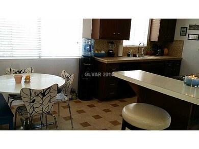 Property Photo. Counter with breakfast room off ki