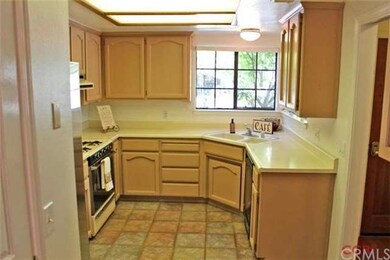 MORE OF THE KITCHEN, WHICH OVERLOOKS THE FRONT YAR