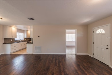 The living space, dining area and kitchen open up 