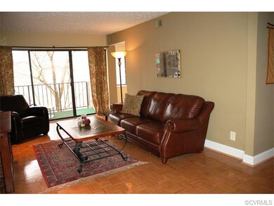 Another view of living room with sliders to balcon