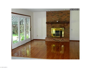 Family Room with fireplace opens to living room, k