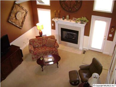 THE GAS LOG FIREPLACE WITH CUSTOM MANTLE AND CERAMIC TILE HEARTH MAKE THE FIREPLACE THE PERFECT CENTER PIECE FOR THIS ELEGANT HOME.