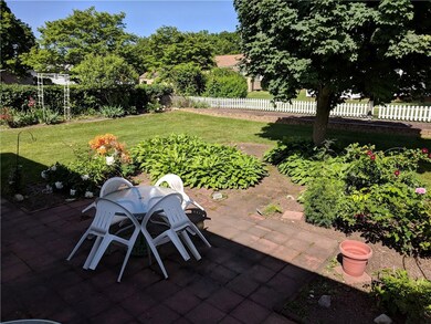 Backyard/patio with raised vegetable bed at rear o