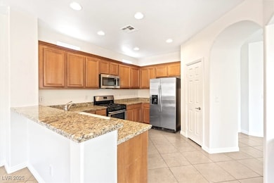 Large Kitchen with Stainless Steel Appliances and granite Breakfast Bar