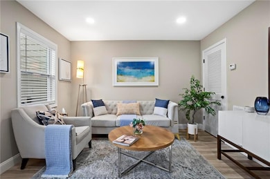 Living room with hardwood / wood-style floors