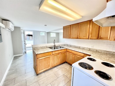 A fully equipped kitchen with durable countertops