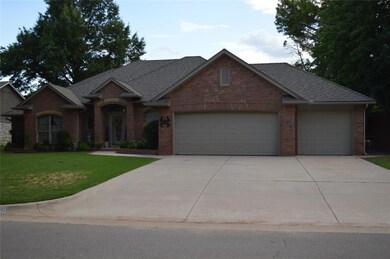 Ranch-style home featuring a front lawn and a gara