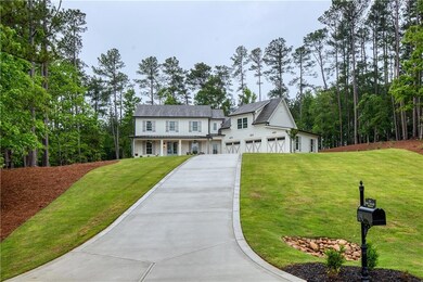 View of front of property with concrete driveway, 