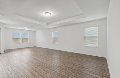 Expansive gathering room bathed in natural sunlight *Model representation
