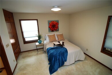 The master suite features a private half bath, a b