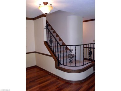 Foyer, teak hardwood floor, unique curved wall alo