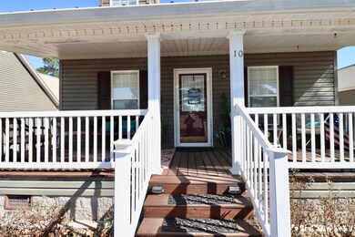 Doorway to property with covered porch