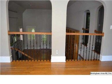 Upstairs den flows to large living room for great 