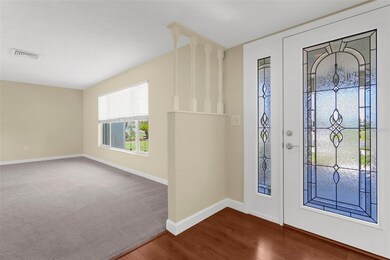 Foyer with living room on right of home